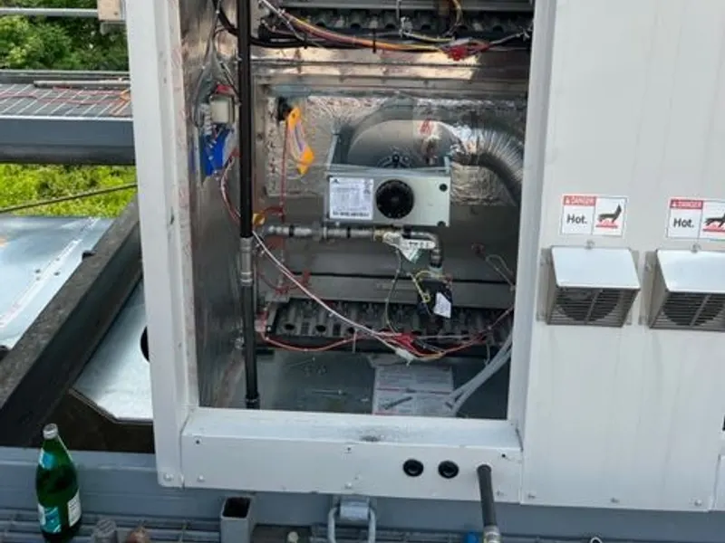 Indoor air-handling equipment and controls in a building mechanical room.