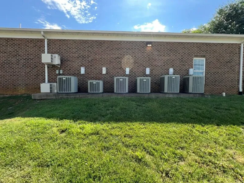 Six-unit commercial AC condenser bank installed by Logan Mechanical